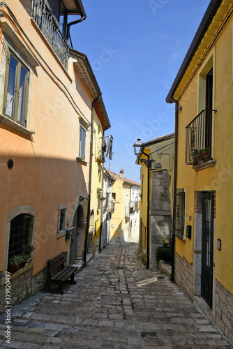 A narrow street among the old houses of Baselice  a small town in the province of Benevento  Italy.