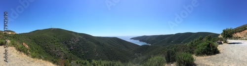 Mountain landscape panorama on sunny summer day with clear sky in Greece with sea gulf on background