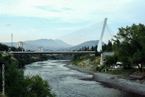 Millenium bridge in Podgorica, Montenegro, at dusk. Also called most Milenijum, it is one of the main landmarks and an iconic bridge of the capital city of Crna Gora
