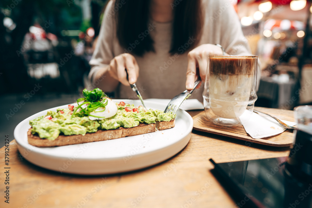 Guacamole avocado healthy food and asian woman background at outdoor restaurant on day Guacamole avocado healthy food and asian woman background at outdoor restaurant on day