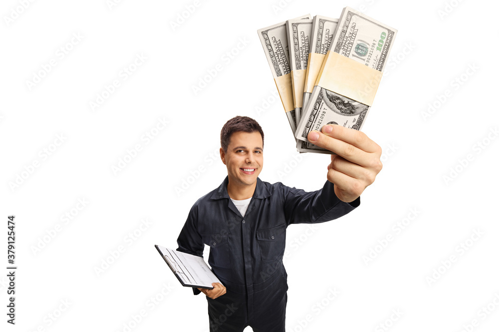 Auto mechanic worker holding money and smiling at the camera Auto mechanic worker holding money and smiling at the camera