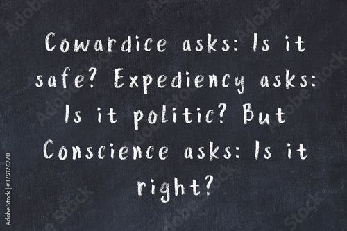 Chalk wise inscription on black chalkboard