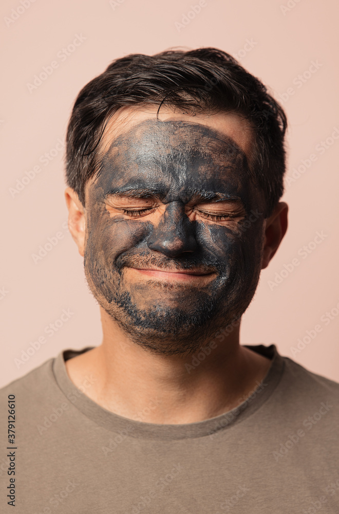 funny guy with a cosmetic mask on his face