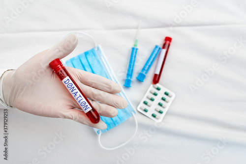 Word writing text Donation. Business photo showcasing something that is given to a charity, especially a sum of money Extracted blood sample vial ready for medical diagnostic examination