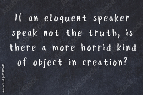 Chalk inscription of smart quote on black desk