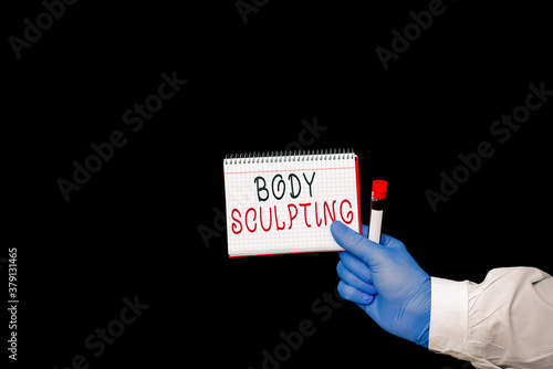 Conceptual hand writing showing Body Sculpting. Concept meaning activity of increasing the body s is visible muscle tone Displaying Sticker Paper Accessories With Medical Gloves On