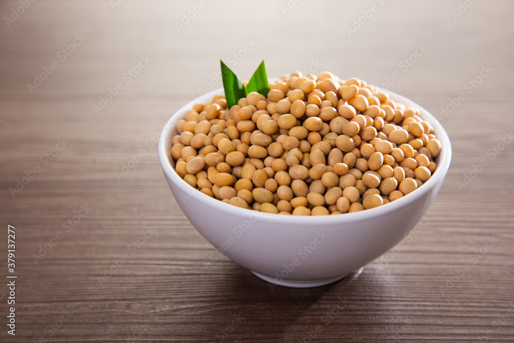 Soy bean on wooden surface. Healthy raw food Soy bean on wooden surface. Healthy raw food