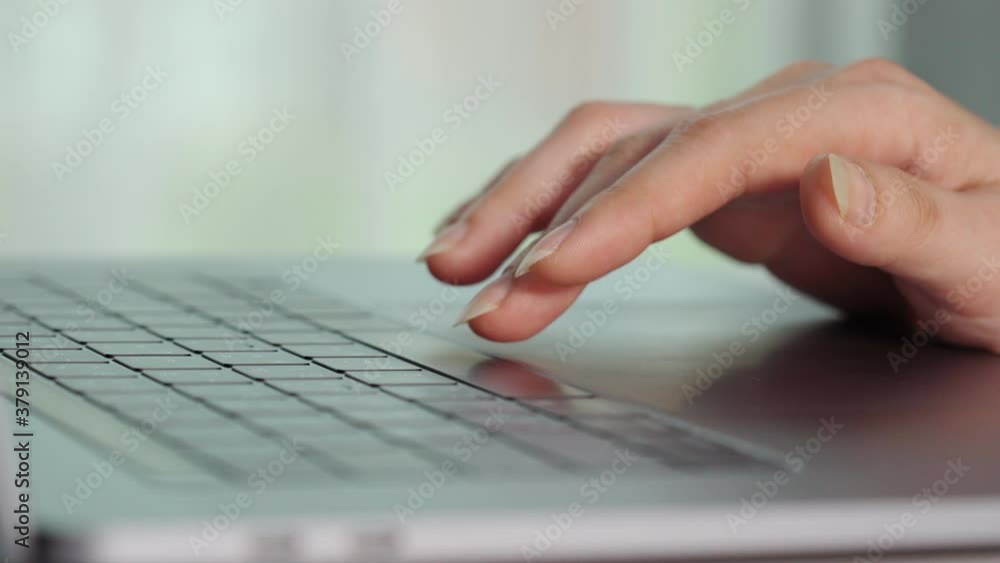 close-up female hand pressing space bar button on a laptop keyboard close-up female hand pressing space bar button on a laptop keyboard