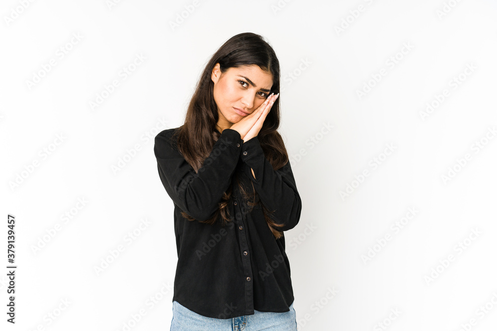 Young indian woman isolated on purple background yawning showing a tired gesture covering mouth with hand. Young indian woman isolated on purple background yawning showing a tired gesture covering mouth with hand.