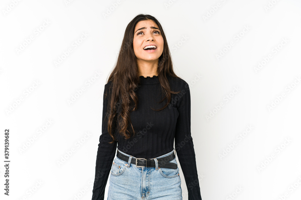 Young indian woman isolated on purple background shouting very angry, rage concept, frustrated. Young indian woman isolated on purple background shouting very angry, rage concept, frustrated.
