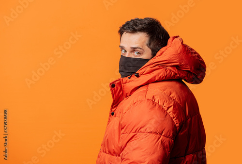 guy in face mask and down jacket