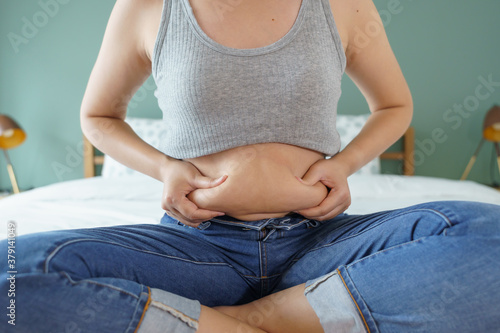 Fototapeta Women body fat belly