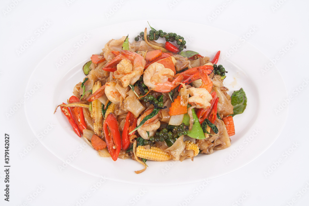 Spicy stir fried flat noodle with prawn and holy basil leaves