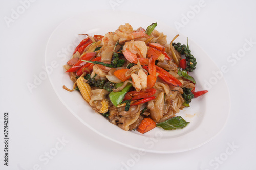 Spicy stir fried flat noodle with prawn and holy basil leaves