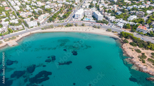 Aerial view of turquoise clear water and sandy beach of Ireon or Limni Vouliagmeni Lake in Peloponnese  Greece 