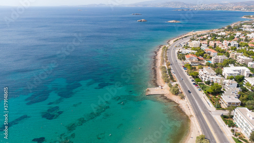 Aerial view of turquoise clear water and sandy beach of Ireon or Limni Vouliagmeni Lake in Peloponnese, Greece 