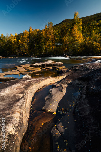 River wild. Hallingdalselva in autumn. Shot in at Gol, Hallingdal, Norway photo