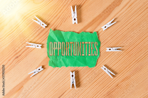 Text sign showing Opportunities. Business photo text good chance for advancement, favorable juncture circumstance Colored clothespin papers empty reminder wooden floor background office photo