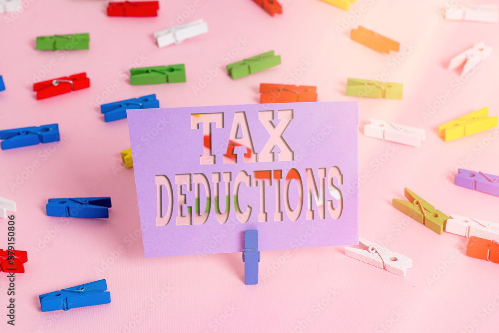 Handwriting text writing Tax Deductions. Conceptual photo an amount or cost that subtracted from someone s is income Colored clothespin papers empty reminder pink floor background office pin Handwriting text writing Tax Deductions. Conceptual photo an amount or cost that subtracted from someone s is income Colored clothespin papers empty reminder pink floor background office pin