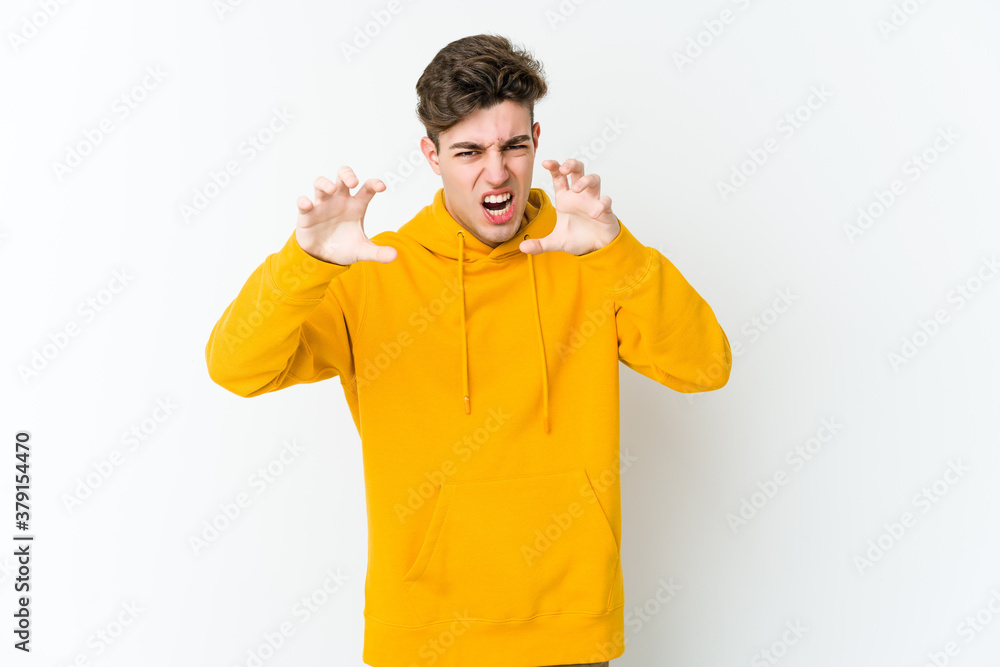 Young caucasian man isolated on white background showing claws imitating a cat, aggressive gesture. Young caucasian man isolated on white background showing claws imitating a cat, aggressive gesture.