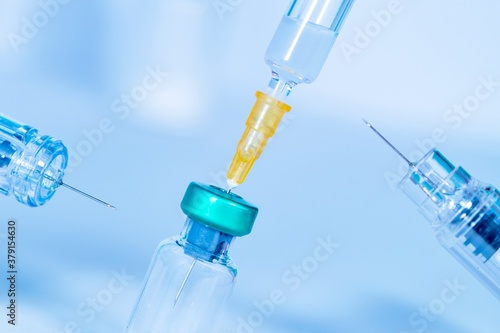 Pharmaceutical research. Coronavirus, Covid 19 virus Syringe and vaccine vial. Research, Medicine, pharmacy and Healthcare cure concept. vertical image. horizontal image