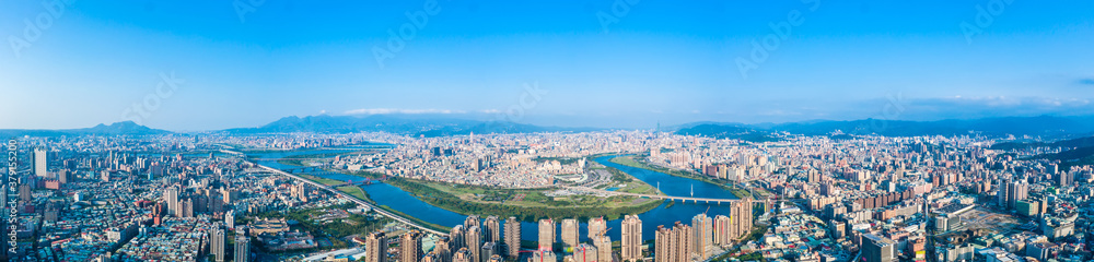 Fototapeta premium Taipei City Aerial View - Asia business concept image, panoramic modern cityscape building bird’s eye view under daytime and blue sky, shot in Taipei, Taiwan.