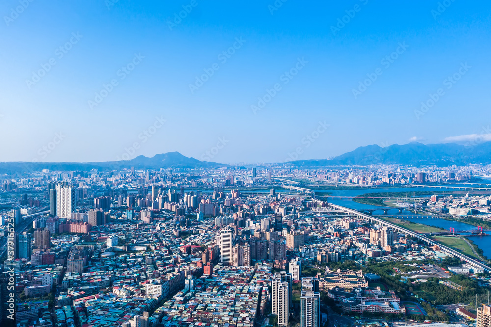 Taipei City Aerial View - Asia business concept image, panoramic modern cityscape building bird’s eye view under daytime and blue sky, shot in Taipei, Taiwan. Taipei City Aerial View - Asia business concept image, panoramic modern cityscape building bird’s eye view under daytime and blue sky, shot in Taipei, Taiwan.