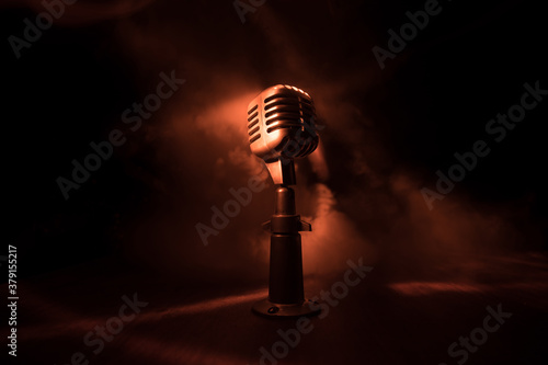 Microphone for sound, music, karaoke in audio studio or stage. Mic technology. Voice, concert entertainment background. Speech broadcast equipment. Live pop, rock musical performance photo