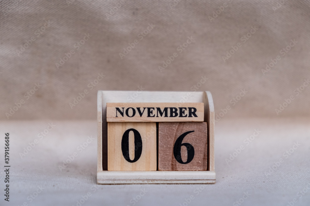 November 6th. Image of November 6 wooden color calendar on white canvas background. empty space for text November 6th. Image of November 6 wooden color calendar on white canvas background. empty space for text