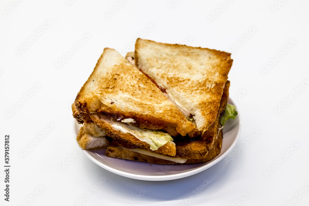 Composition of Sandwiches lying on a plate on a light background Composition of Sandwiches lying on a plate on a light background