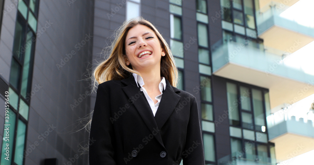 Confident young female manager outdoor in a modern urban setting Confident young female manager outdoor in a modern urban setting