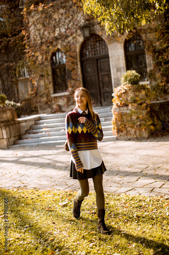 Pretty young woman walking ...