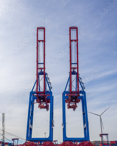 in port there are cranes for loading and unloading ships © karegg