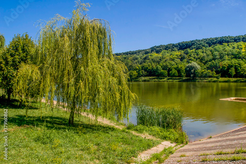 Fototapeta Naklejka Na Ścianę i Meble -  Beautiful village lake in full color