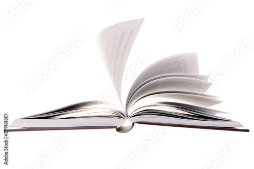 Open hardcover book with flying pages, isolated on white background. Sel