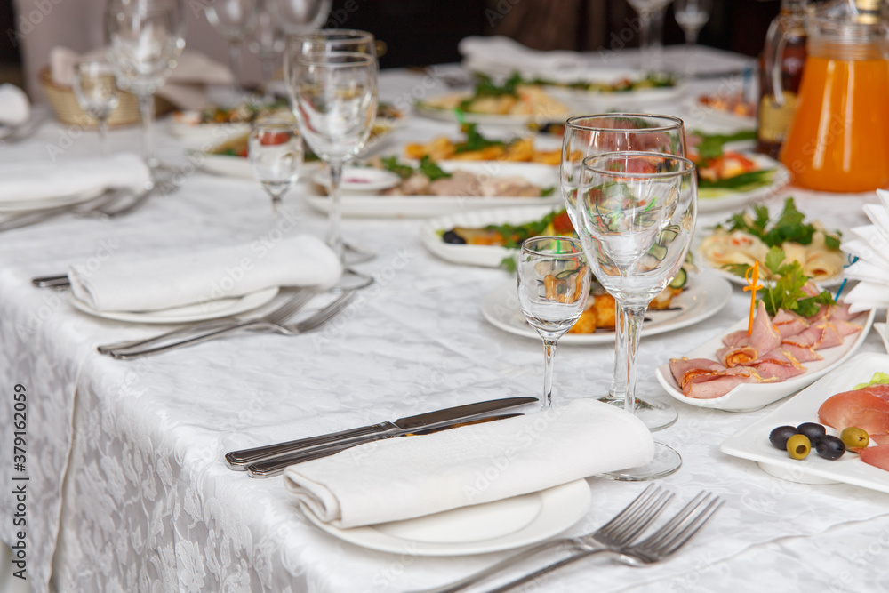 Table set for wedding or another catered event dinner. Table set for wedding or another catered event dinner.