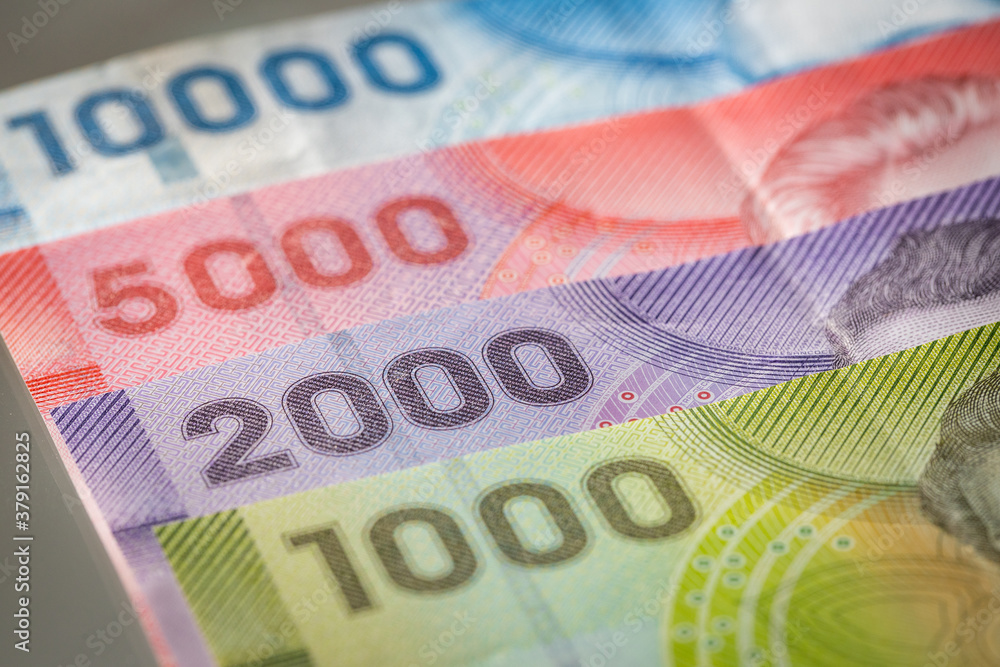 Obraz premium Chile money, Pesos, Paper notes of various values lying on the desk