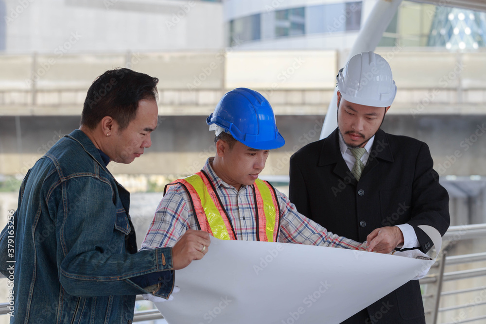 Group of businessmen and engineers discussing about construction plan isolated on white background Group of businessmen and engineers discussing about construction plan isolated on white background
