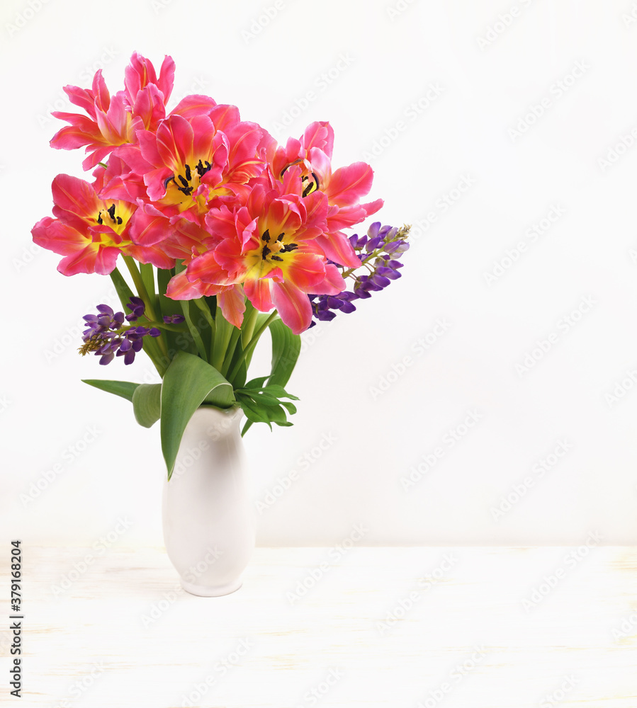 Bouquet of coral tulip flowers in a vase