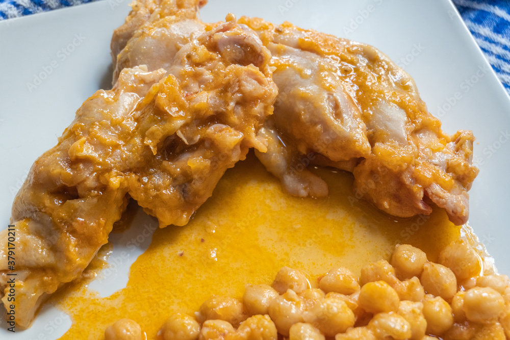 Typical Spanish dish, braised pork feet with chickpeas