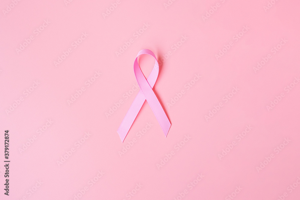 October Breast Cancer Awareness month, Pink Ribbon on pink background for supporting people living and illness. International Women, Mother and World cancer day concept October Breast Cancer Awareness month, Pink Ribbon on pink background for supporting people living and illness. International Women, Mother and World cancer day concept