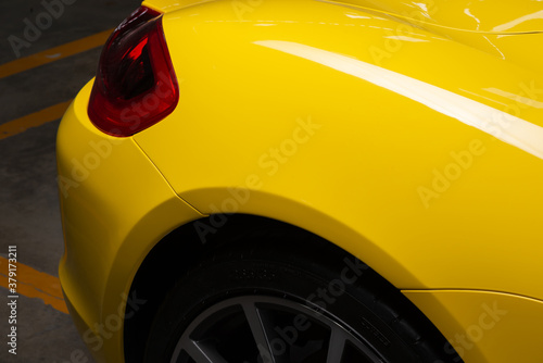 Auto body repair series: Yellow sports car after repaint