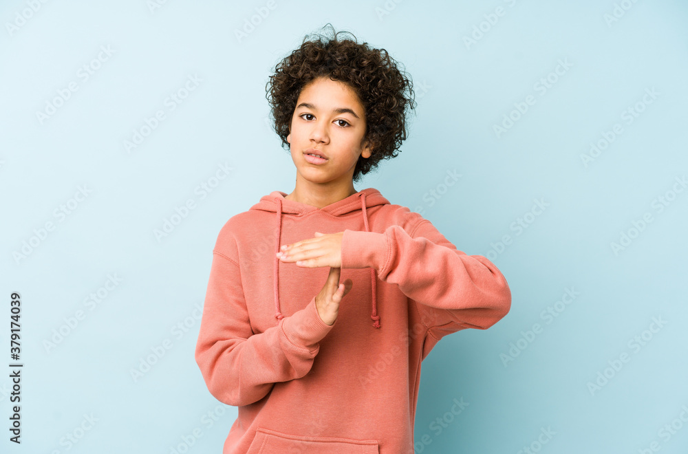 African american little boy isolated showing a timeout gesture. African american little boy isolated showing a timeout gesture.