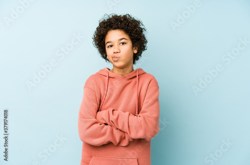 Canvas Print African american little boy isolated frowning face in displeasure, keeps arms folded