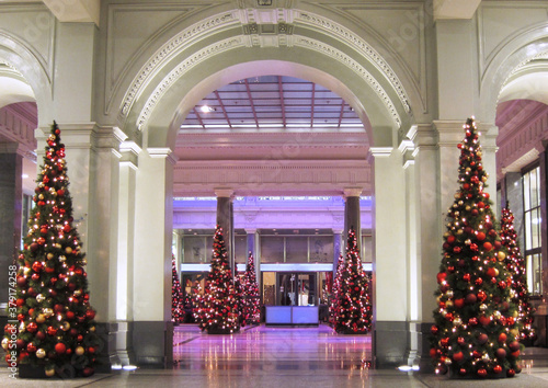Beautifully decorated interior with christmas trees during Christmas holiday season.