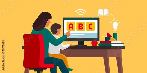 Homeschooling: kid learning at home with his mother