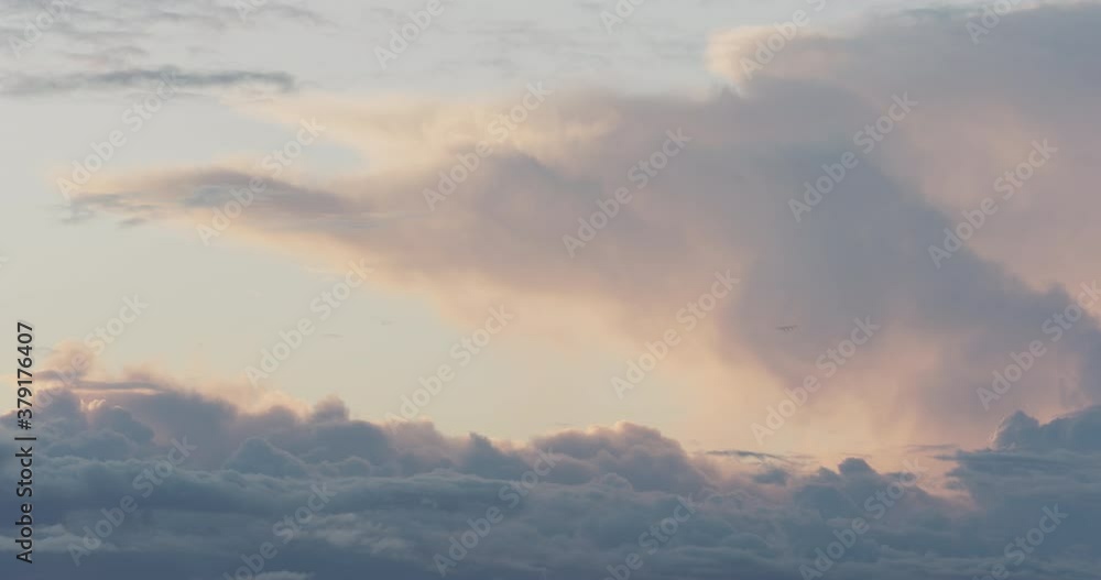 timelapse of clouds slowly float in the sky during sunset timelapse of clouds slowly float in the sky during sunset