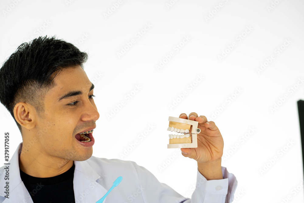 Portrait of man Asian medical doctor physician standing isolated on white background copy space Portrait of man Asian medical doctor physician standing isolated on white background copy space