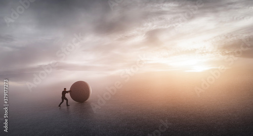Tableau sur toile Businessman pushing heavy rock.