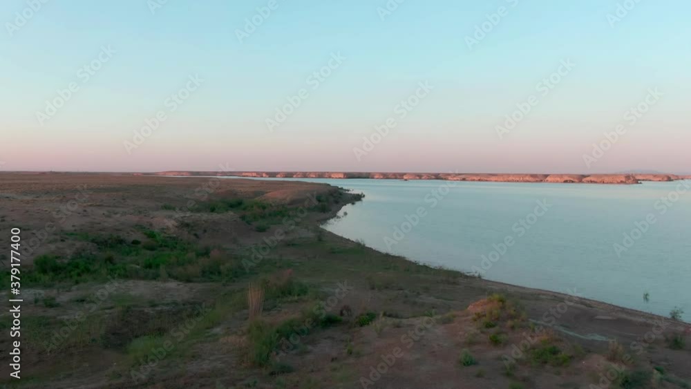 Blue brackish water lake in the middle of desert, filmed by drone Blue brackish water lake in the middle of desert, filmed by drone